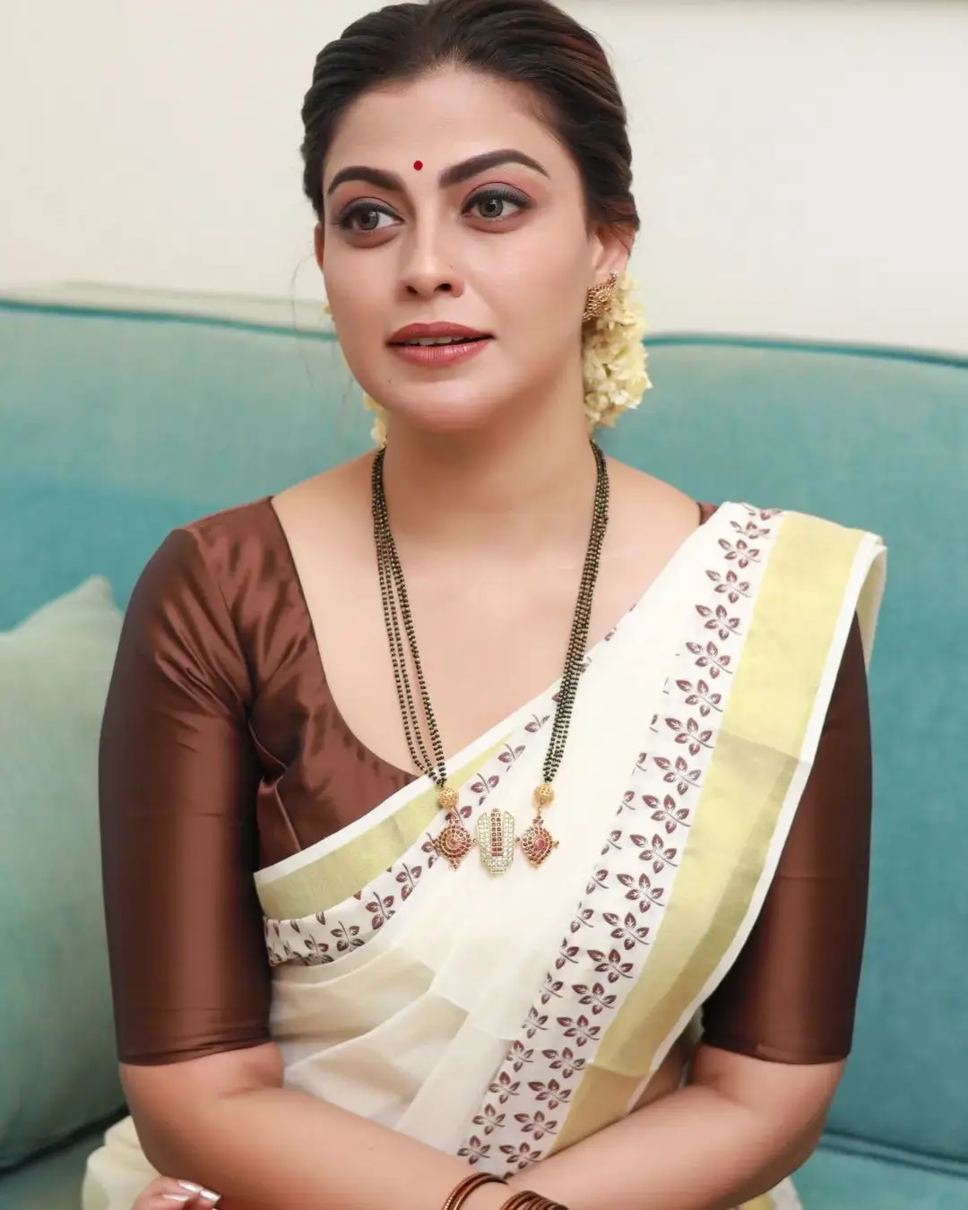 Anusree Nair Wearing Beautiful Earrings Jewellery White Saree Maroon Blouse